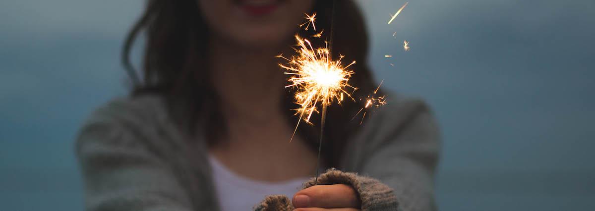 Person holding fire sparkler